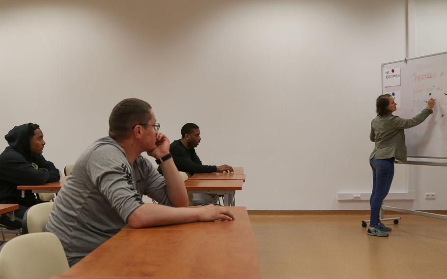 A Polish teacher writes on a whiteboard during a language class for U.S. soldiers at Bemowo Piskie Training Area, Poland, June 9, 2020.