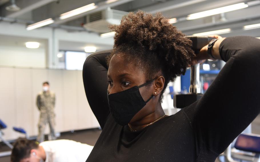 Air Force Tech Sgt. Nikita Sutton lifts a 20-pound dumbbell behind her back on Monday, June 15, 2020, at the Southside Fitness Center on Ramstein Air Base, Germany. The main gym on Ramstein reopened to service members for the first time Monday since closing its doors in March due to the outbreak of the coronavirus.