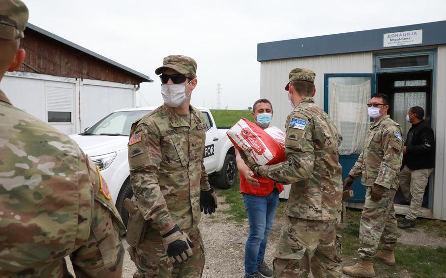 Kosovo Force Regional-Command East personnel deliver  goods to a medical facility May 14, 2020, in Ugljare, Kosovo. RC-E personnel assisted Kosovo Red Cross facilities in distributing eight tons of flour and disinfectant alcohol to Kosovo schools and medical clinics. 