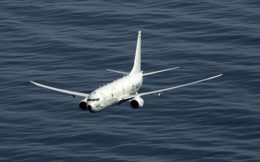 A P-8A Poseidon maritime patrol and reconnaissance aircraft flies over the Atlantic Ocean during an exercise, March 29, 2020. Two Poseidons, the guided-missile destroyer USS Roosevelt and the submarine USS Indiana are participating in Dynamic Mongoose 2020 in the north Atlantic.