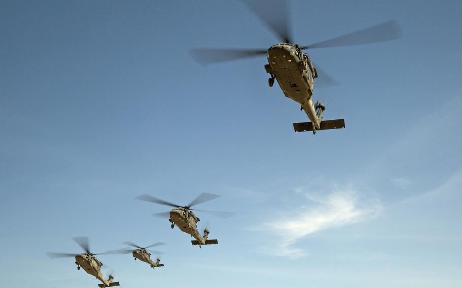 In 2014, 25th Infantry Division UH-60 Black Hawks fly in formation over the National Training Center at Fort Irwin, Calif. The U.S. plans to sell Black Hawks to Lithuania, to bolster NATO capabilities in one of the alliance's most exposed regions.