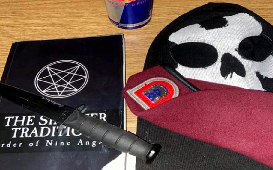 This photo provided by the Justice Department seized from an iCloud account belonging to Army Pvt. Ethan Melzer, displays personal effects, including paraphernalia associated with the extremist group Order of the Nine Angles. Melzer pleaded not guilty on Monday, July 6, 2020, to charges he conspired with the satanic neo-Nazi group to plot an ambush on his unit during a planned deployment to Turkey.