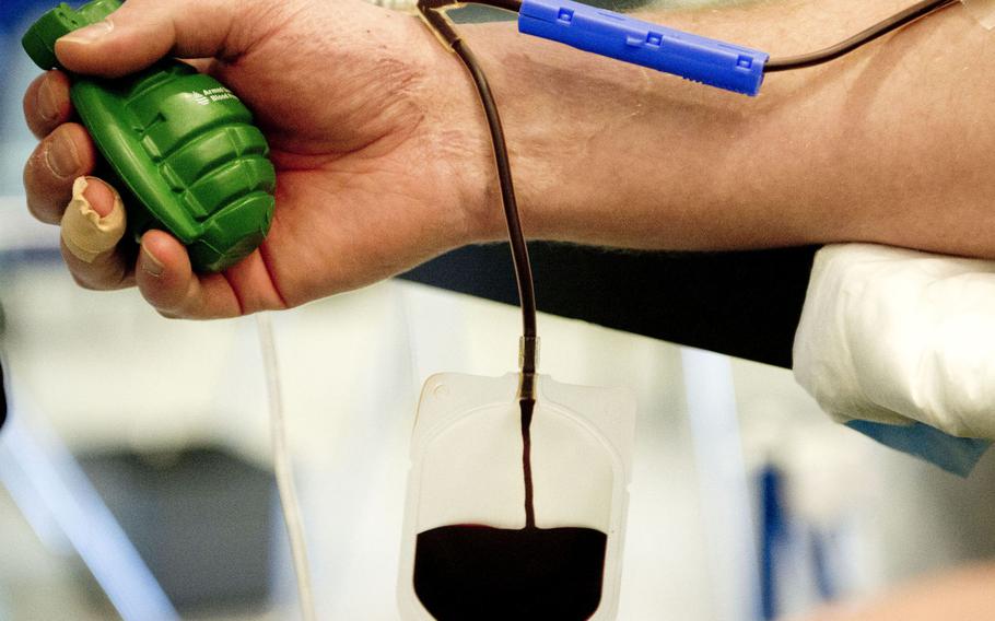 A service member donates blood at a drive at Ramstein Air Base, Germany, in 2018. The Food and Drug Administration has loosened restrictions on who can give blood, making potentially thousands more troops, veterans and retirees who have lived in Europe eligible to donate.