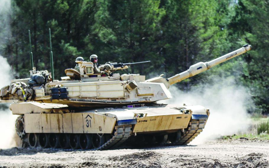 A U.S. Army tank maneuvers a trail at Drawsko-Pomorskie Training Area, Poland, in April 2020. Soldiers from 1st Armored Brigade Combat Team, 1st Cavalry Division, out of Fort Hood, Texas, are headed for Poland to participate in a Defender-Europe 20 exercise.