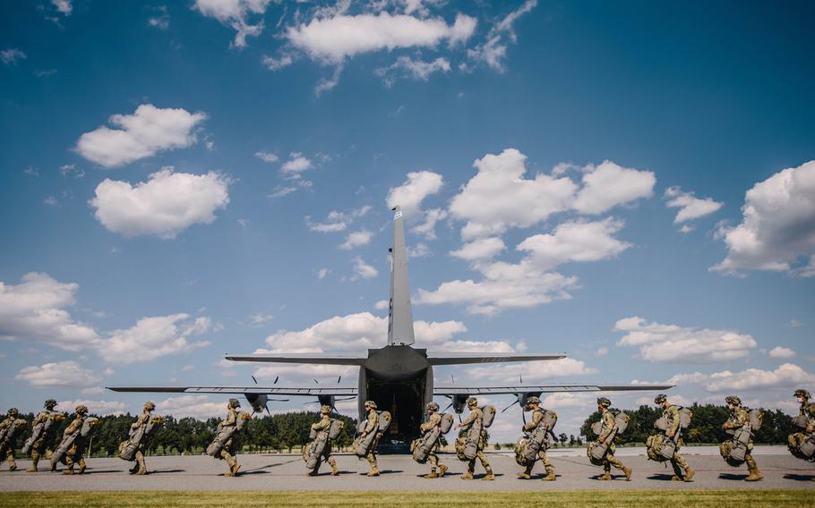 U.S. paratroopers assigned to the 173rd Airborne Brigade make their way to an aircraft for airborne operations at Grafenwoehr Training Area, Germany, July 23, 2020, in preparation for Exercise Saber Junction 20.