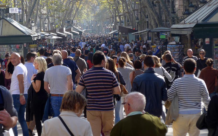 People stroll down Barcelona, Spain's famed Las Ramblas in pre-coronavirus times. Official military travel for U.S. European Command personnel to Belgium and Spain now requires official approval, but leisure travel is allowed. Policy at some commands within Europe remained unclear Tuesday. German health officials have cautioned that the Spanish regions of Catalonia, which includes Barcelona, along with Navarre and Aragon, are risk areas and travel could require a quarantine upon return to Germany.