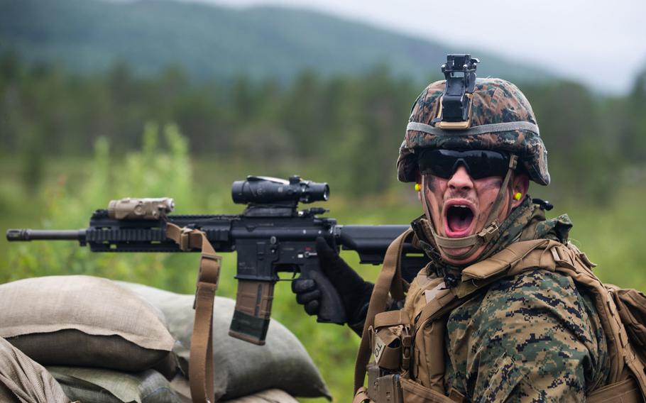 A U.S. Marine with Marine Rotational Force-Europe 20.2, Marine Forces Europe and Africa, yells commands during training in Setermoen, Norway, July 22, 2020.  The Marine Corps is ending  continuous rotations to Norway starting this fall, officials said.