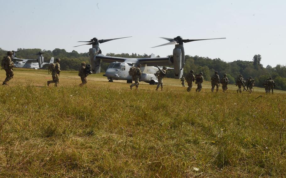 Soldiers with the 173rd Airborne Brigade rush toward Marine, MV-22 Ospreys in Grafenwoehr, Germany, on Aug. 10, 2020, during Exercise Saber Junction. The Marines flew at least three Ospreys around 1,200 miles from Moron in Spain to Grafenwoehr for the exercise.