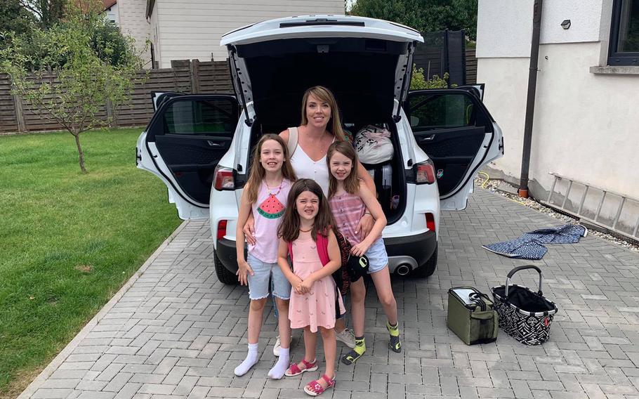 Tara Krause and her three daughters pose outside their home near Ramstein Air Base in Germany on Aug. 12, 2020, just before heading to Italy by car for a vacation. A day earlier, low-cost airline Ryanair barred the Krauses from traveling to Greece from Frankfurt-Hahn airport, citing Greek government restrictions on travelers coming from the U.S. However, the Krauses were coming from Germany.