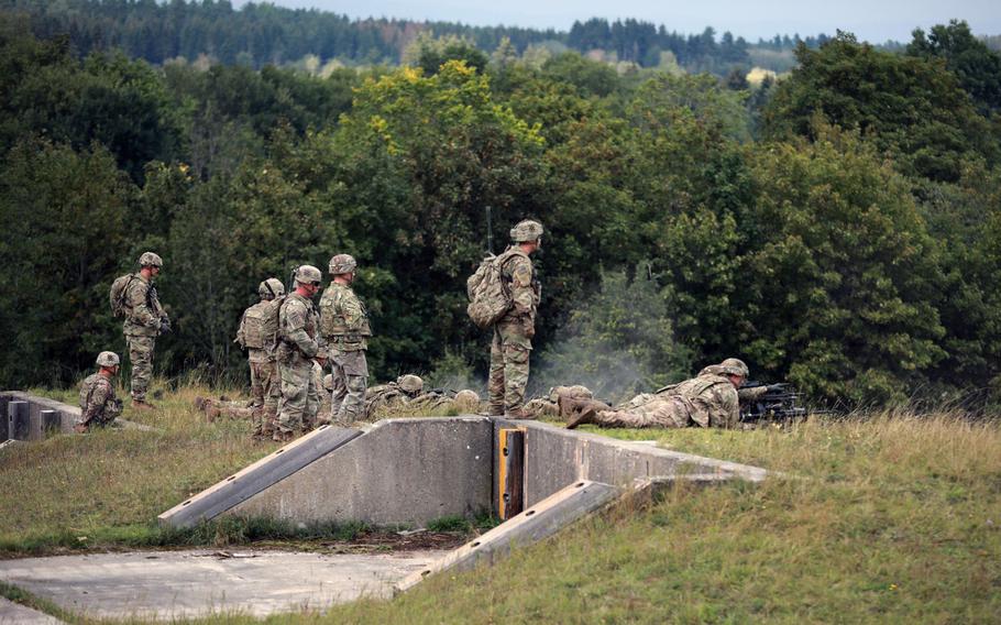 Soldiers assigned to the 3rd Infantry Division fire light machine guns during an exercise at Grafenwoehr Training Area, Germany, Sept. 1, 2020. Germany is planning a major construction project at the sprawling U.S.  training area, which was not included in a Pentagon plan to withdraw thousands of American troops from Germany.