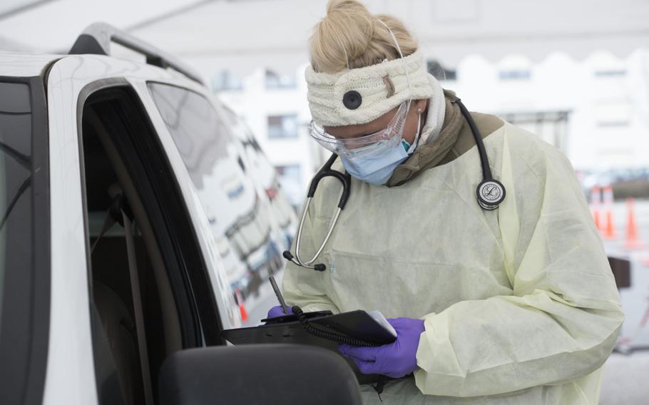 Staff Sgt. Maxime Copley, 86th Medical Group, takes patient information at the coronavirus screening drive-thru at Ramstein Air Base, Germany, March 31, 2020. Germany on Wednesday reported more than 4,000 new infections, while Kaiserslautern earlier this week listed eight new active cases among U.S. forces in its area.