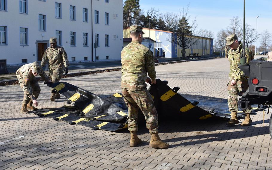Soldiers prepare the fueling area to conduct refuel-on-move operations at Barton Barracks, Ansbach, Germany, in February 2020, en route to Zagan, Poland, as part of Defender-Europe 20. U.S. European Command is holding off turning over land to German authorities, including Barton, as it assesses the possible effects of President Donald Trump's proposal to withdraw some 12,000 troops from Germany.