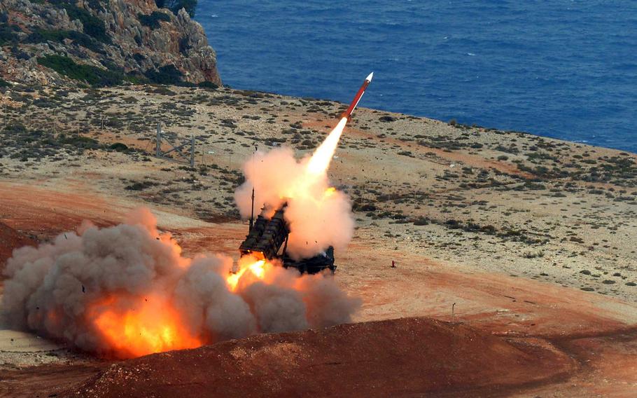 A Patriot missile bursts out of its launcher at the NATO air missile firing installation outside Chania on the Greek island of Crete in 2015. U.S. soldiers will man German Patriot systems during live fire drills that kicked off Nov. 12, 2020.