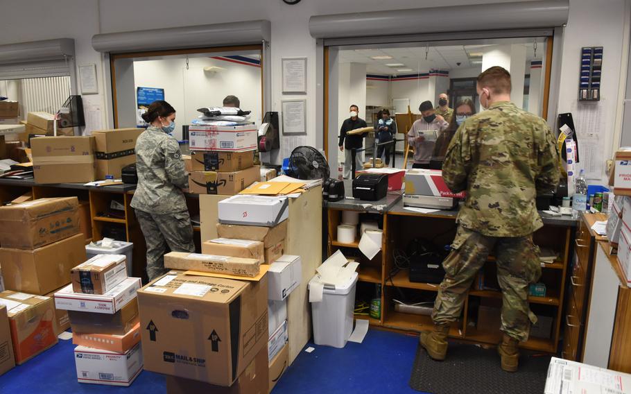 Military postal clerks Staff Sgt. Kaela Roberts and Senior Airman Ronnie Crawford work the finance window at the Ramstein Northside Post Office at Ramstein Air Base, Germany, on Friday, Nov. 13, 2020. Postal clerks are spending extra time inputting custom forms manually as the U.S. Postal Service?s new electronic customs form system has been riddled with problems.