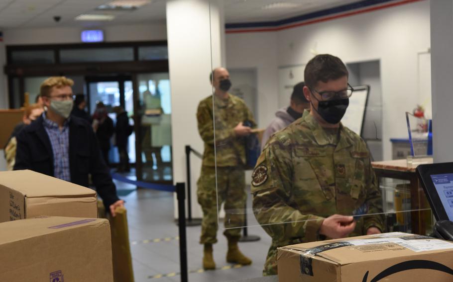 A long line forms on Nov. 13, 2020, at the Northside Post Office at Ramstein Air Base, Germany, as customers wait to mail packages. Many customers have been unable to fill out electronic customs forms required since September by the U.S. Postal Service, leading to longer wait times as postal clerks input the information manually.