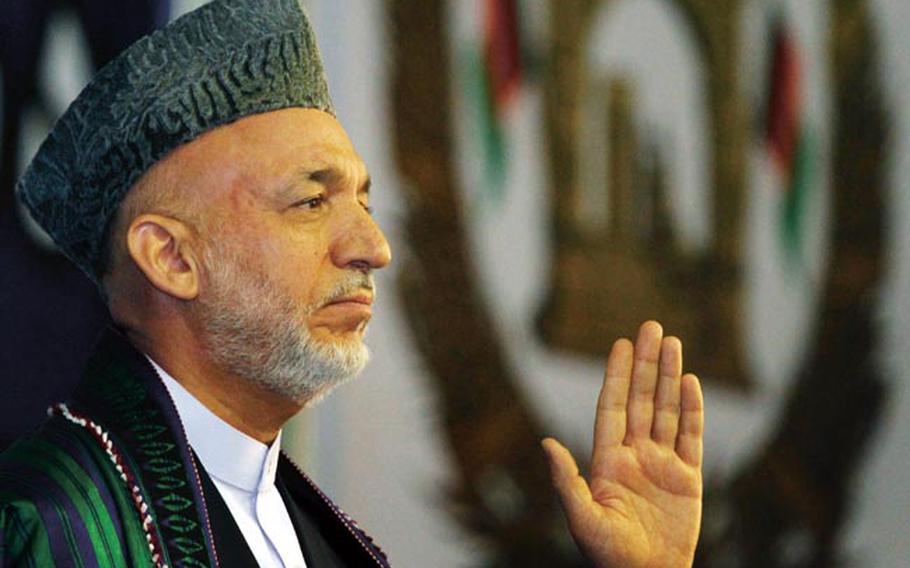 Afghan President Hamid Karzai gives a speech Friday, the last day of a peace conference in Kabul.