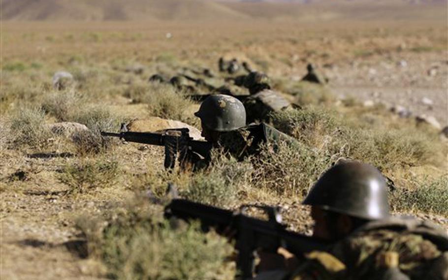 Afghan National Army soldiers participate in exercises Sunday with NATO forces outside Herat, Afghanistan.