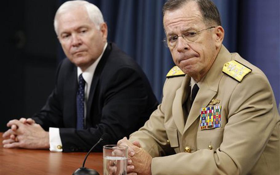 Defense Secretary Robert Gates (left) and Joint Chiefs Chairman Adm. Mike Mullen speak to reporters at a Pentagon press conference on June 24. 