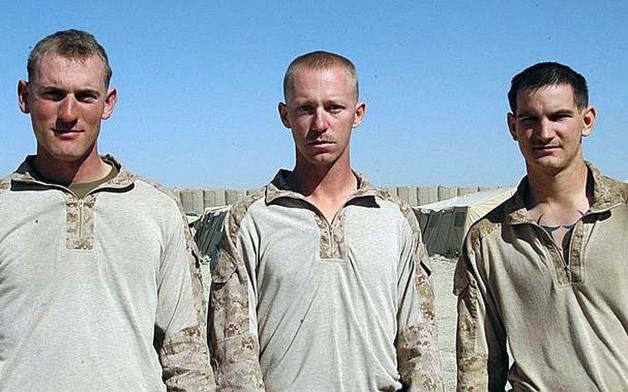 Sgt. Tyler Richards, left, Sgt. Thomas Hopman, center, and Cpl. Kenneth Bowles, all of Company E, 2nd Battalion, 1st Marines, all recently had close encounters with IEDs in Afghanistan and walked away without a scratch thanks to the fact that the explosives were poorly made and ended up misfiring.