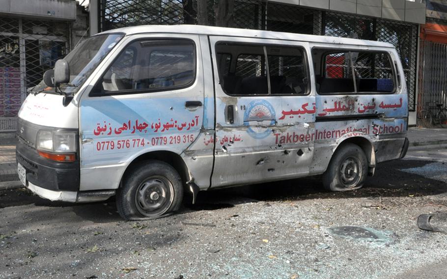 A school van parked near the U.S. Embassy in Kabul was struck by a rocket-propelled grenade fired by insurgents who attacked the embassy Tuesday afternoon. Bystanders reported that no one was in the van but that a shopkeeper was injured by flying debris.