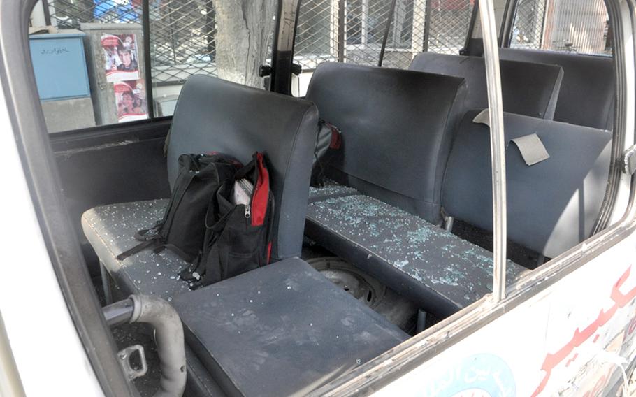 Bits of glass litter the seats of a school van that was struck by a rocket-propelled grenade fired by insurgents who attacked the U.S. Embassy in Kabul on Tuesday afternoon. Bystanders reported that no one was in the van, which was parked near the embassy, but that a shopkeeper was injured by flying debris.