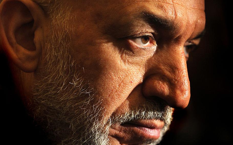 Afghanistan President Hamid Karzai talks to reporters on Capitol Hill May 7, 2009 in Washington, D.C.