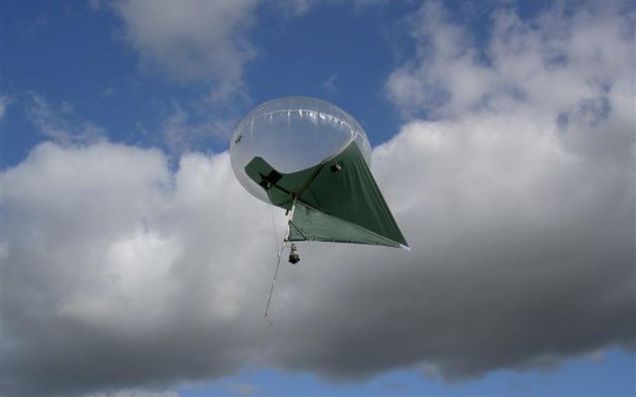 The military is testing part-blimp, part-kite Helikites as another option for aerial surveillance, as this one is shown flying in June of 2007.