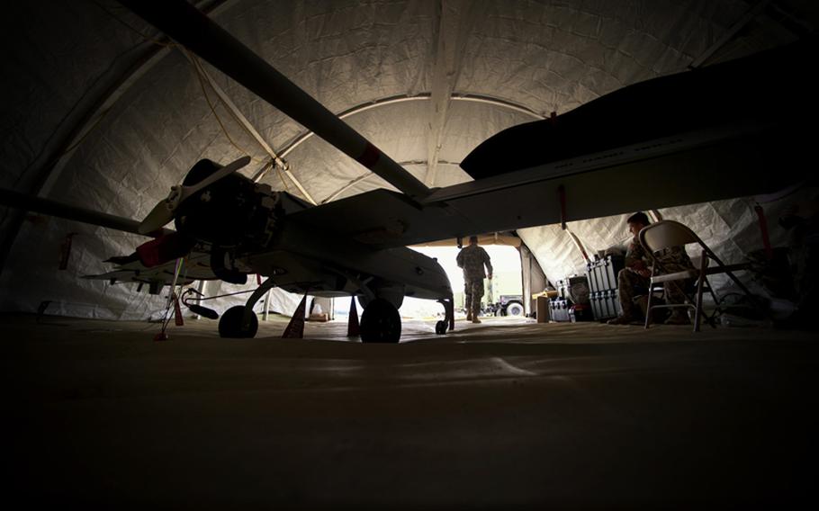 Mechanics work on the UAS or Tactical Unmanned Aerial Vehicle, at Camp Ripley in Little Falls, Minnesota, July 19, 2012.