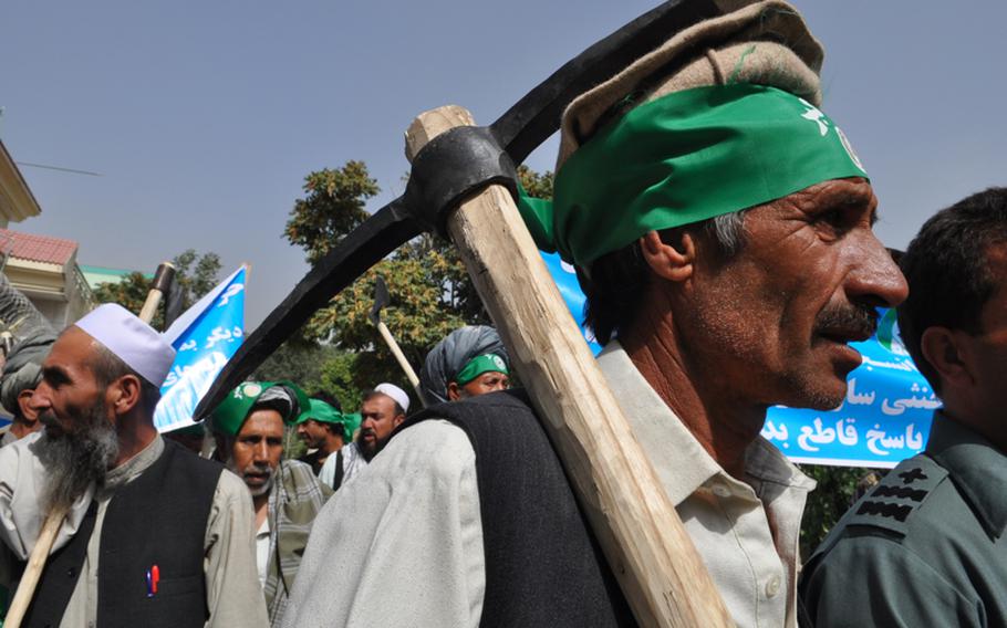 Protesters carried tools and axes Sept. 16, 2012, during an anti-Pakistan demonstration in Kabul. The protest was the latest sign of growing Afghan nationalism and anti-Pakistan sentiment in response to rocket attacks that have been coming from Pakistan all summer.