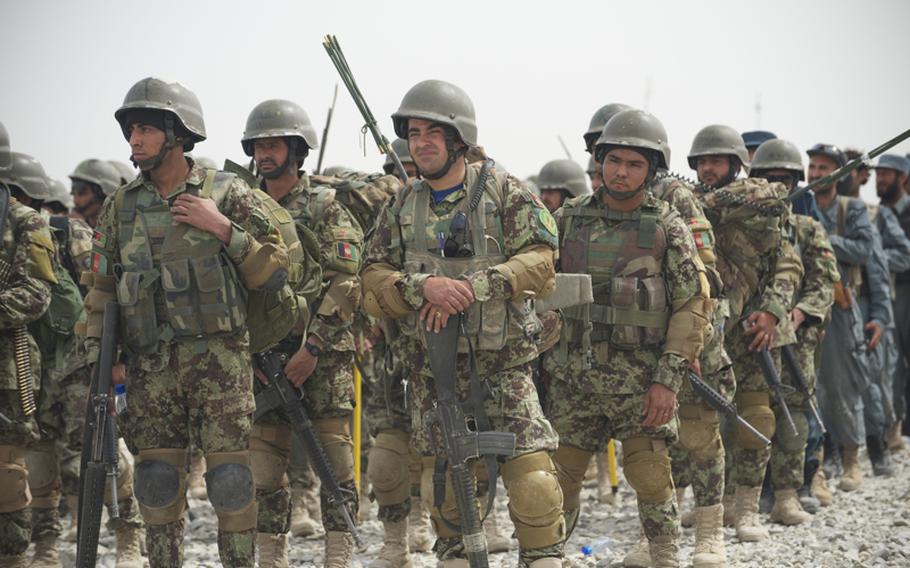 Soldiers from the 1st Brigade, 205th Afghan National Army Corps prepare for training in Kandahar province, Afghanistan, in March 2012. 
