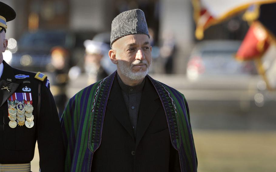 Afghanistan's President Hamid Karzai passes and reviews U.S. troops as he is welcomed to the Pentagon on Jan. 10, 2013.
