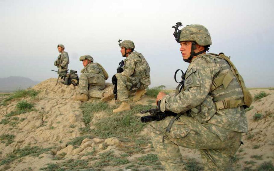 U.S Army Soldiers from Company A, 2nd Battalion, 508th Parachute Infantry Regiment move into position to support Afghan National police who are moving in to apprehend a suspect during a cordon and search of Pana, Afghanistan, June 9, 2007.