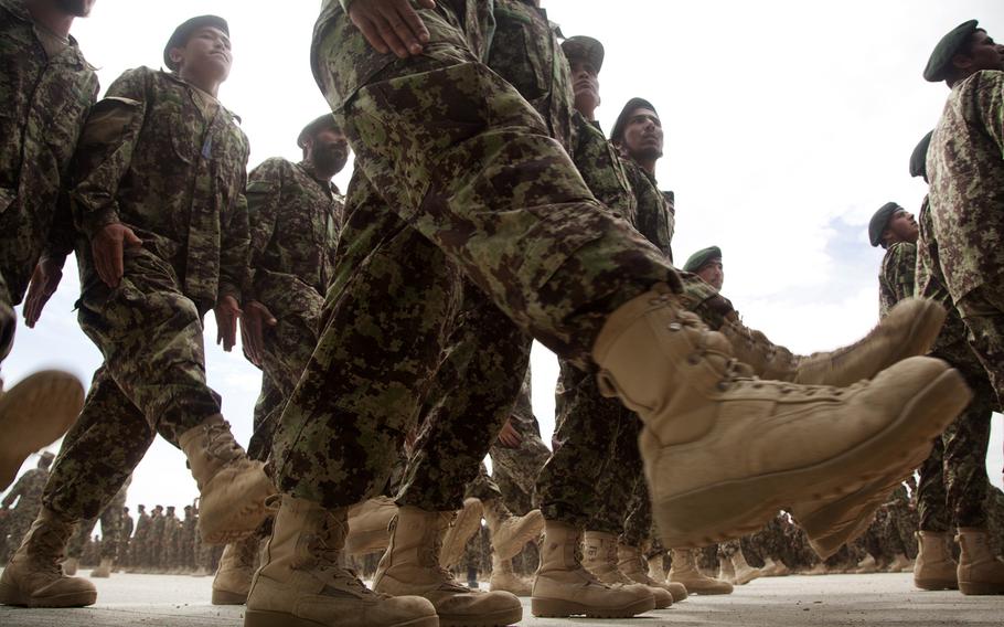 Afghan Nation Army soldiers assigned to the 215th Corps participate in a graduation ceremony on Camp Shorabak, Helmand province, Afghanistan, March 28, 2013. 