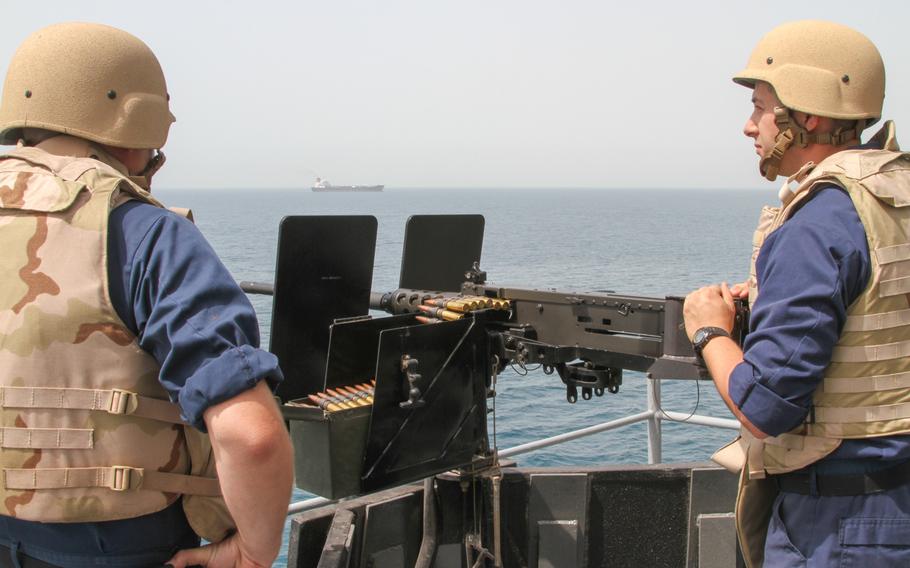 Petty Officer 2nd Class John Churchman, left, and Petty Officer 2nd Class Alex Head watch for threats as the USS Ponce gets underway from Bahrain for an international mine countermeasure exercise involving 41 countries on May 13, 2013.

Hendrick Simoes/Stars and Stripes