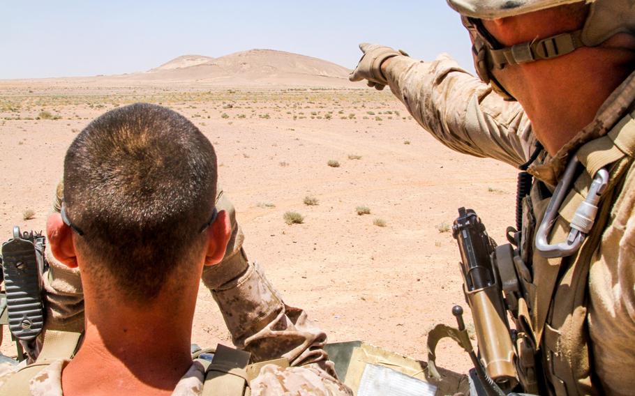 U.S. Marines assigned to the 26th Marine Expeditionary Unit search for targets during a live fire exercise in Al Quweira, Jordan on June 13, 2013. About 5,000 U.S. personnel are participating in a 12-day annual military exercise called Eager Lion. 