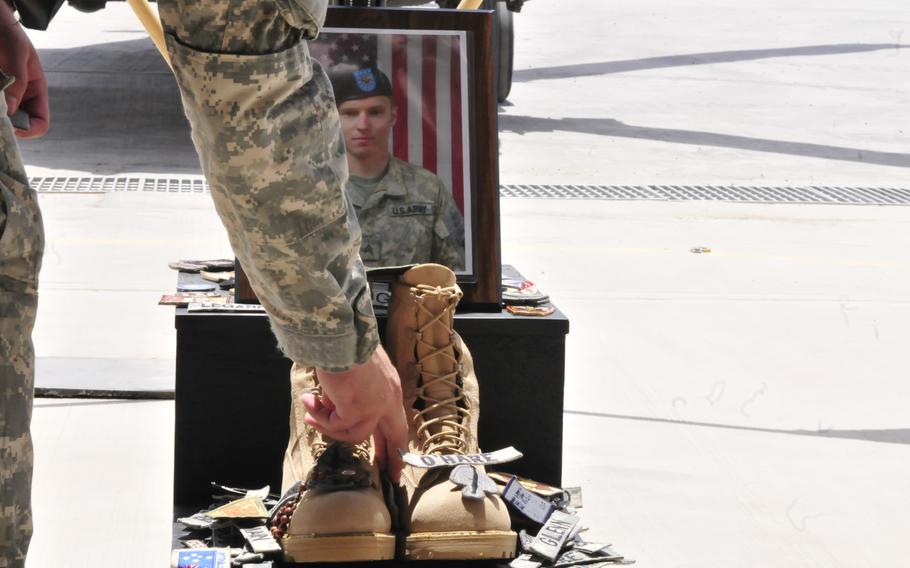 In this file photo from 2010, soldiers of Task Force Destiny pay tribute to their fallen comrade, Staff Sgt. Brandon Silk, during his memorial ceremony at Forward Operating Base Tarin Kowt, Afghanistan.

