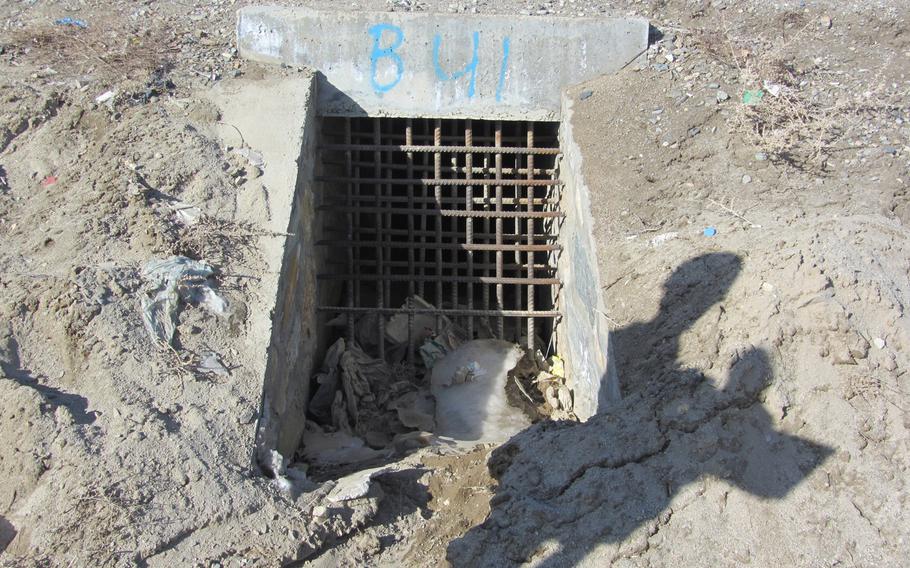 A culvert showing a so-called culvert denial system -- grates to block insurgents from placing bombs in culverts running under roads. A report released by the Special Inspector General for Afghanistan Reconstruction on Julyu 23, 2013, detailed fraud and negligence in the installation of the systems.

