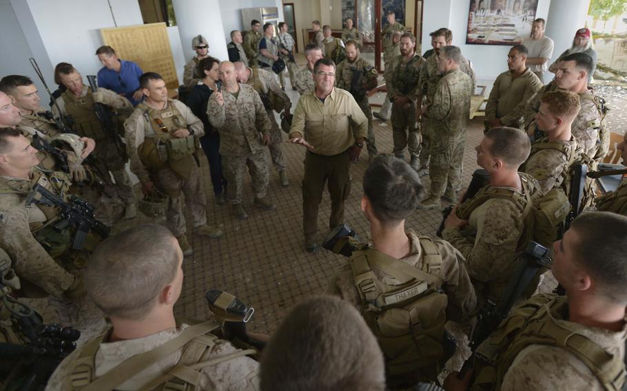 Deputy Secretary of Defense Ashton B. Carter, addresses troops as he surveys  the damage to the U.S. Consulate in Herat, Afghanistan, Sept. 14, 2013. 