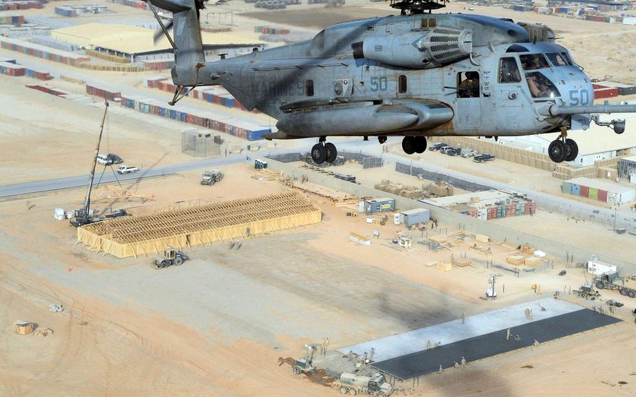 A CH-53 Sea Stallion helicopter flies over a Seabee project site at Camp Leatherneck in Afghanistan on Jan. 5, 2011. 