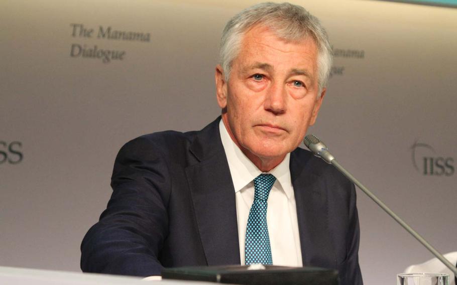 Defense Secretary Chuck Hagel prepares to speak at the Manama Dialogue, an annual security conference in Bahrain Dec. 7, 2013.