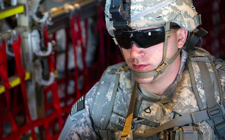 A U.S. soldier with Combined Joint Task Force-Horn of Africa's East Africa Response Force travels on a C-130 Hercules from Camp Lemonnier, Djibouti, on Dec. 18, 2013. The EARF deployed to South Sudan supporting the ordered departure of the U.S. Embassy.