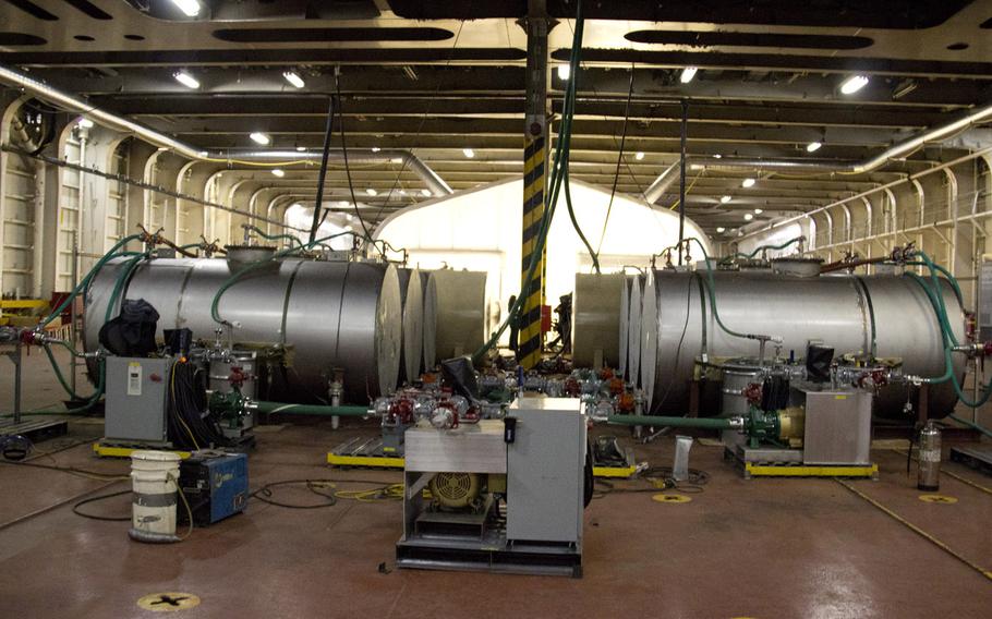 Pictured are waste and reagent containers connected to the Field Deployable Hydrolysis System aboard the Cape Ray docked at the NASSCO-Earl Shipyard in Portsmouth, Va., January 2, 2014. The systems are designed to render chemical warfare material into compounds not usable as weapons. 