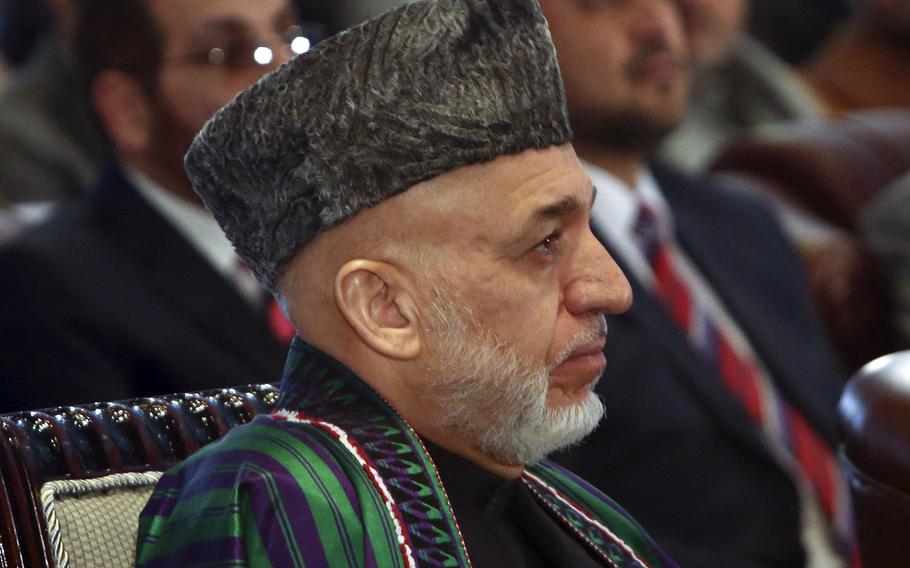 Afghan President Hamid Karzai attends a ceremony marking the start of Afghanistan's educational year at Amani high school, in Kabul, Afghanistan, Saturday, March 22, 2014.
