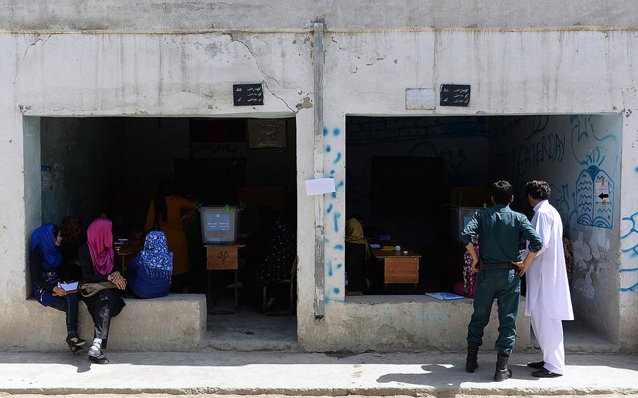 Women staff polling stations designated for female voters in Kabul during a runoff presidential election on June 14, 2014.  Each polling center had separate areas for men and women, both of whom seemed to turn out in lower numbers than during the initial election on April 5.
