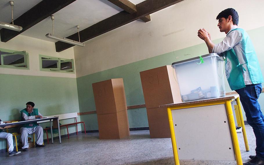 An election worker at a Kabul polling station awaits the arrival of presidential candidate Abdullah Abdullah, who is running against former finance minister Ashraf Ghani to become Afghanistan's next president. The final round of voting took place Saturday. 