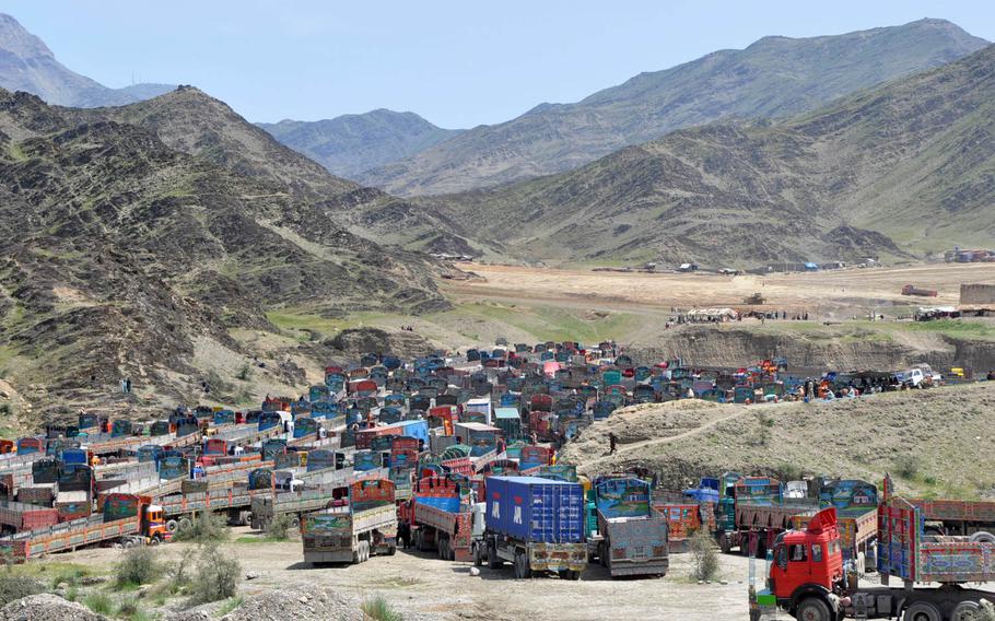 Hundreds of trucks wait to enter Pakistan at the the border crossing at Torkham Gate in Afghanistan in this 2013 file photo.