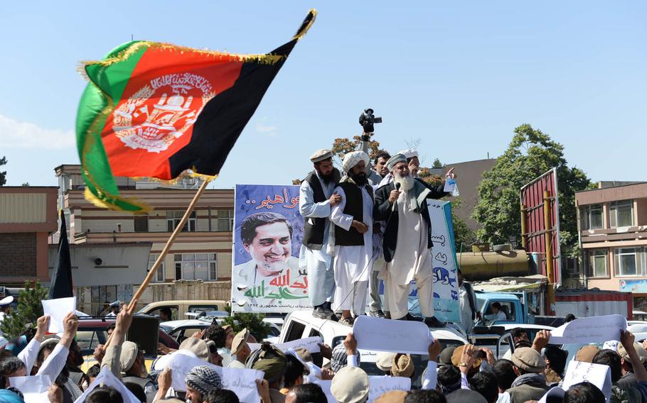 A man addresses a demonstration in Kabul in support of Afghan presidential candidate Abdullah Abdullah, who has claimed the June 14 presidential election runoff was rigged. The protests on Saturday, June 21, 2014, remained peaceful, but many are worried that as the election crisis deepens, the potential for violence is growing.