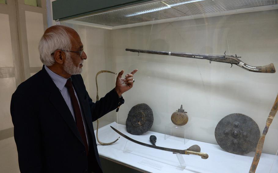 Omara Khan Massoudi, director of the National Museum of Afghanistan in Kabul, points to a jezail musket from the 19th century that is preserved in the museum's collection. He said Afghans often finely decorated such weapons with bits of shell or brass to make them stand out.

