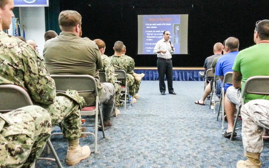 Ali Hassan, a cultural adviser at Naval Support Activity Bahrain, gives a presentation about Islam, the Islamic lunar calender, and about customs and traditions during Ramadan. About 150 personnel at the Bahrain base attended the briefing on Tuesday, June 24, 2014.