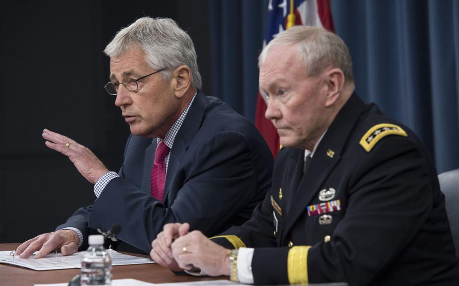 Secretary of Defense Chuck Hagel and Chairman of the Joint Chiefs of Staff Gen. Martin E. Dempsey brief the press at the Pentagon, July 3, 2014. 